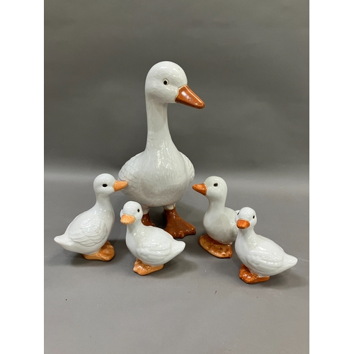 309 - A large ceramic duck together with four others of graduated size