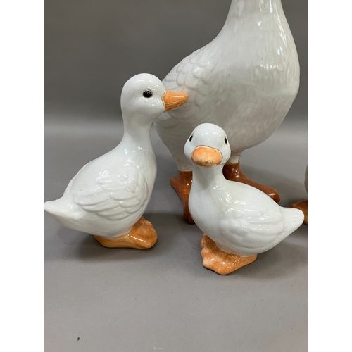 309 - A large ceramic duck together with four others of graduated size