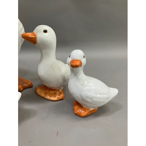 309 - A large ceramic duck together with four others of graduated size