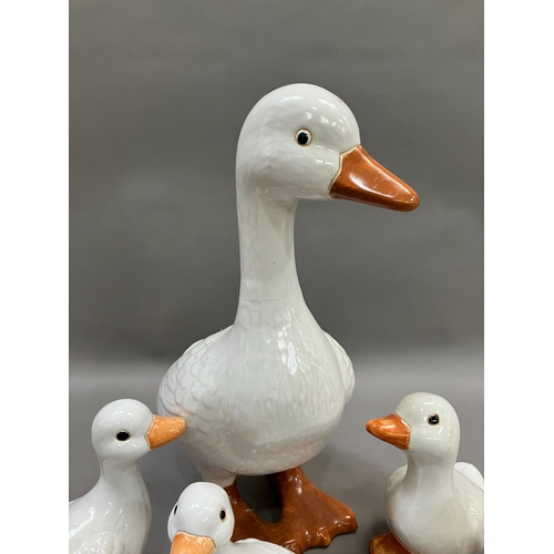 309 - A large ceramic duck together with four others of graduated size