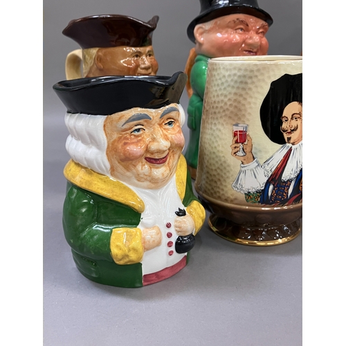 230 - A collection of 19th century and later Toby jugs including some by Woods And Sons and one with a mus... 