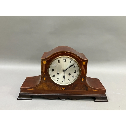 333 - An early 20th century mahogany and inlaid mantel clock having silvered dial with black Arabic numera... 