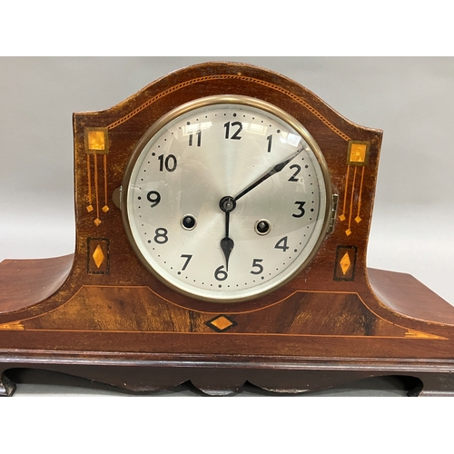 333 - An early 20th century mahogany and inlaid mantel clock having silvered dial with black Arabic numera... 