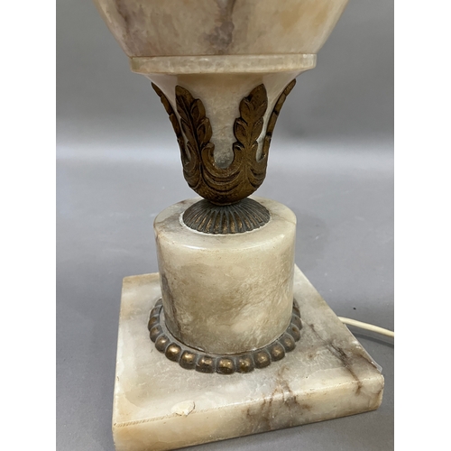 328 - A gilt metal mounted alabaster table lamp of urn form on a square base, complete with shade, 42.5cm ... 