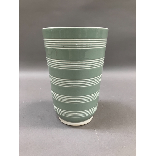 84 - A Keith Murray for Wedgwood celadon green and cream vase of slightly tapered cylindrical form incise... 