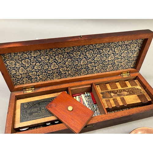 88 - An early 20th century games box with inlaid cover, interior with four whist markers together with a ... 