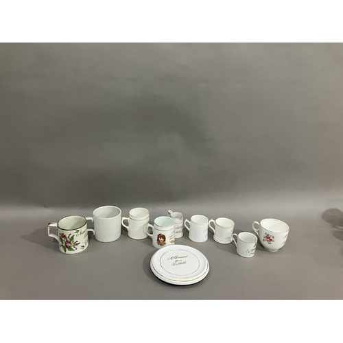 228 - A collection of 19th and early 20th century named mugs, jugs and teapot stand, souvenirs from Newcas... 