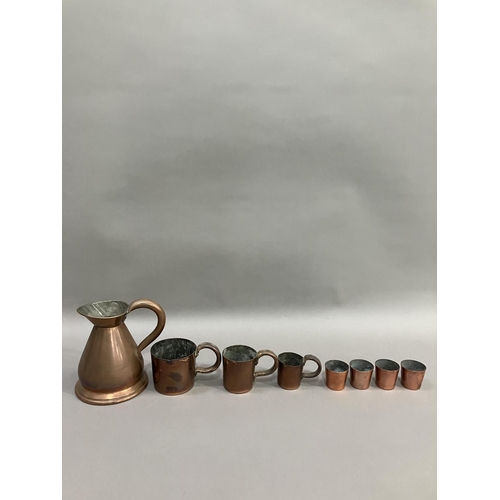 243 - A copper pint measure, a set of three measures in the form of mugs, half pint being the biggest and ... 