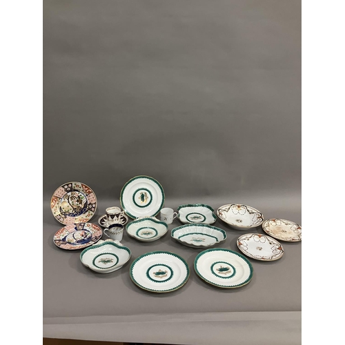 229 - An early to mid century part dessert service bordered in green with green and gilt floral motif to t... 