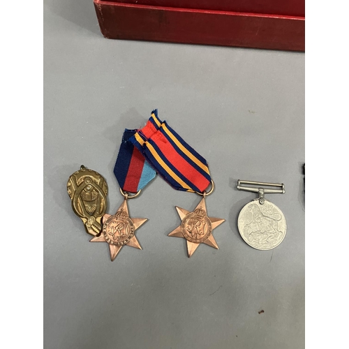 414 - A 1939-1945 Burma Star and a 1939-1945 Defence medal together with a collection of large quantity of... 