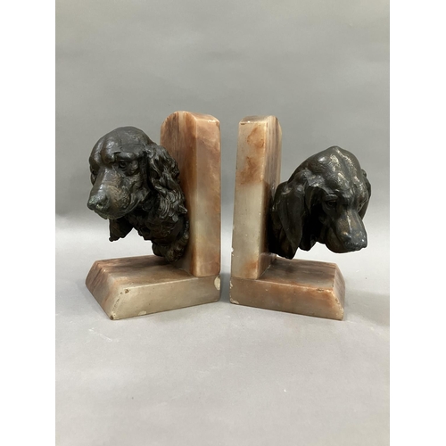 61 - A pair of art deco bronze effect spaniel and blood hound bookends mounted on alabaster, 20cm high