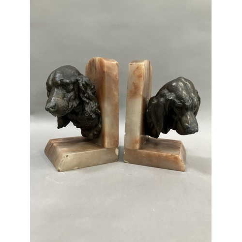 61 - A pair of art deco bronze effect spaniel and blood hound bookends mounted on alabaster, 20cm high