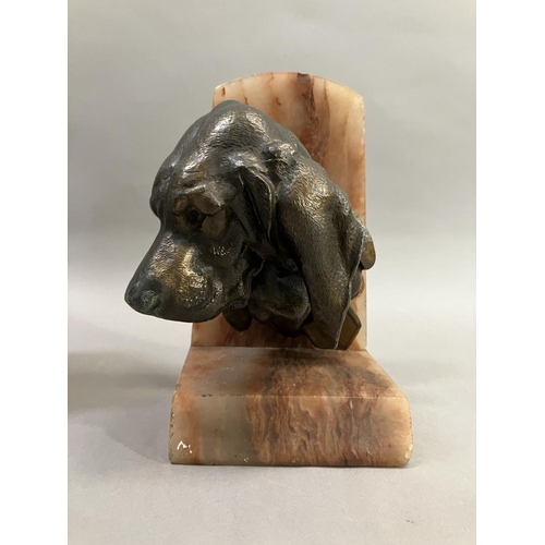 61 - A pair of art deco bronze effect spaniel and blood hound bookends mounted on alabaster, 20cm high