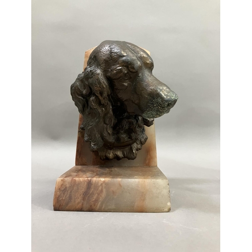 61 - A pair of art deco bronze effect spaniel and blood hound bookends mounted on alabaster, 20cm high