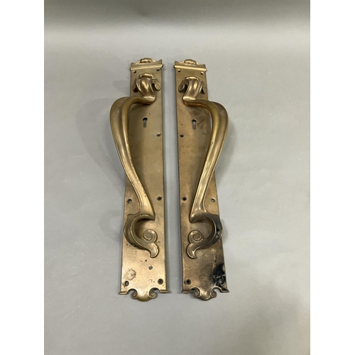 63 - A large pair of brass door handles with keyholes, registered number 553395, 53cm x 7.5cm