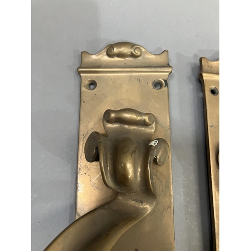 63 - A large pair of brass door handles with keyholes, registered number 553395, 53cm x 7.5cm