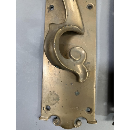 63 - A large pair of brass door handles with keyholes, registered number 553395, 53cm x 7.5cm