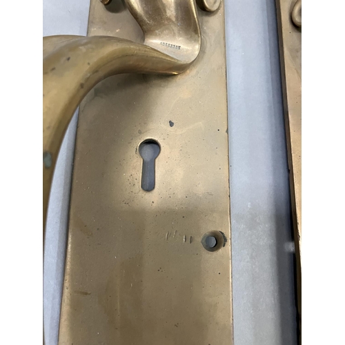 63 - A large pair of brass door handles with keyholes, registered number 553395, 53cm x 7.5cm