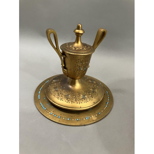 67 - A gilt metal Grand Tour style ink well in the form of an urn with twin loop handles on wide circular... 