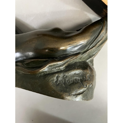 69 - A cast bronze model of a nude woman reclining, indistinctly signed on base 26cm long