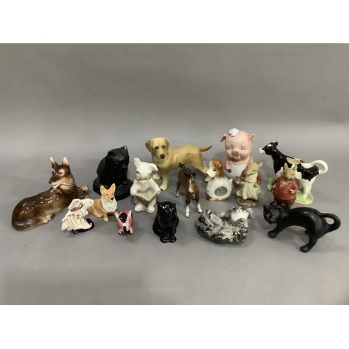 286 - A collection of mainly ceramic animals including dogs, cats, piggy bank, foal, etc