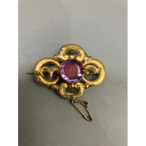 415 - A Victorian amethyst set knot brooch in 9ct gold A/F with base metal repairs, together with an early... 