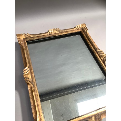 139 - A gilt framed wall mirror, 54cm x 77cm