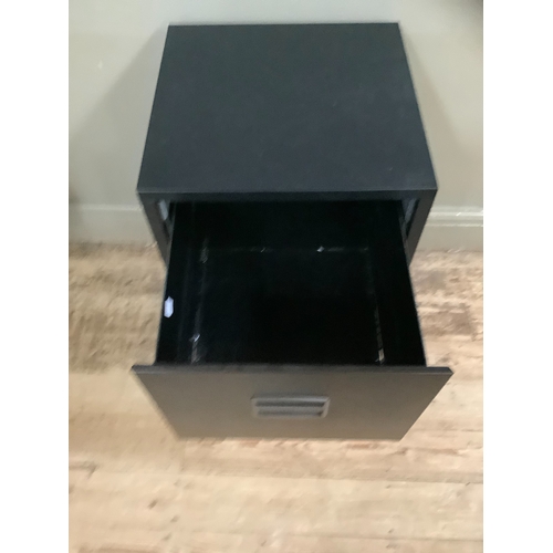 140 - A black two drawer metal filing cabinet