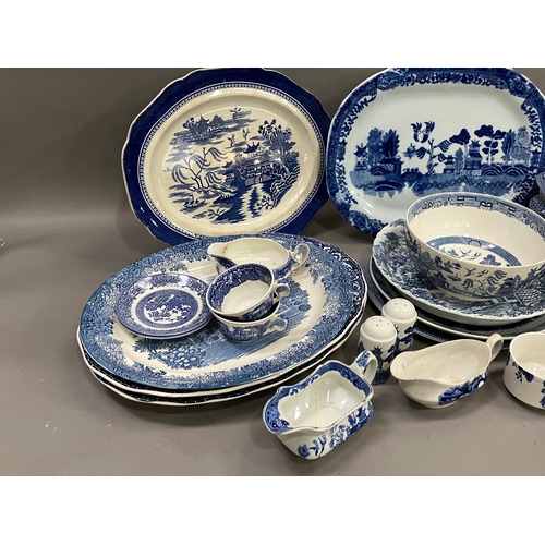 119 - A 19th century lidded willow pattern blue and white tureen with finial, together with other blue and... 