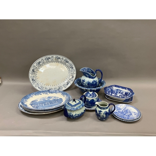 98 - A collection of blue and white ware including jugs, large bowls etc