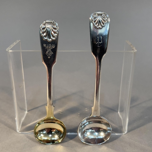 384 - Two Victorian silver fiddle and shell pattern mustard spoons, one engraved with crest 'Nobilis Ira',... 