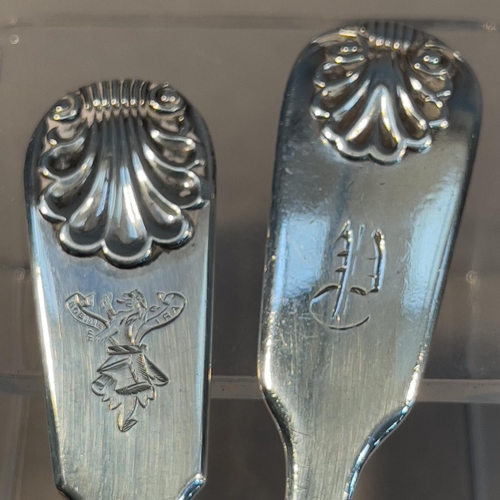 384 - Two Victorian silver fiddle and shell pattern mustard spoons, one engraved with crest 'Nobilis Ira',... 