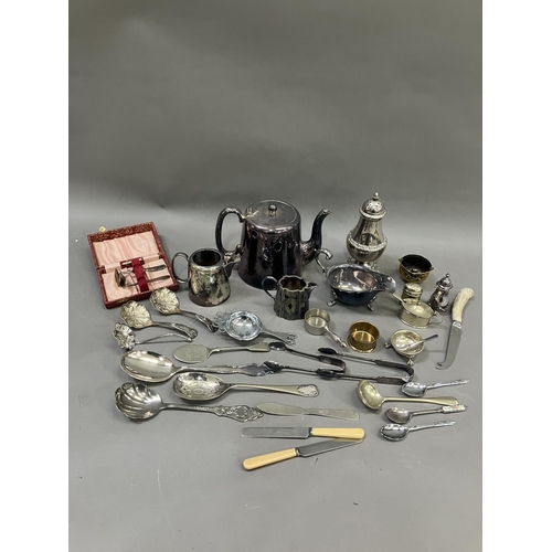 231 - A collection of silver plated ware including sugar sifter, teapot, hot water jug etc