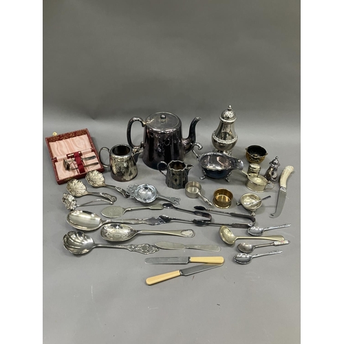 231 - A collection of silver plated ware including sugar sifter, teapot, hot water jug etc