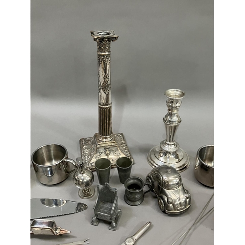 250 - A moulded silver plate on copper candlestick, another silver plate candlestick, two pairs of plated ... 