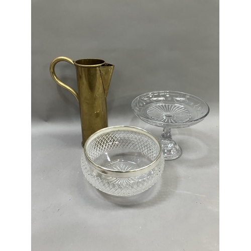 260 - A Mappin and Webb cut glass dessert bowl, an etched and moulded brass tazza and a brass jug formed a... 