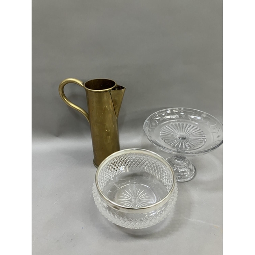 260 - A Mappin and Webb cut glass dessert bowl, an etched and moulded brass tazza and a brass jug formed a... 