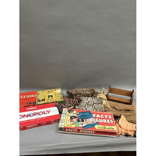 282 - Three vintage board games including Cluedo and Monopoly, two curtain tassels, a python skin handbag,... 