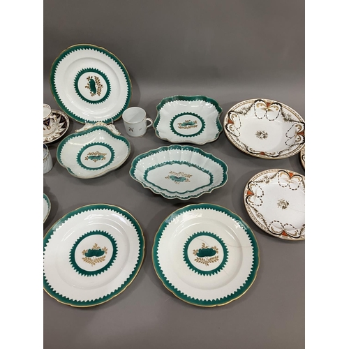 229 - An early to mid century part dessert service bordered in green with green and gilt floral motif to t... 