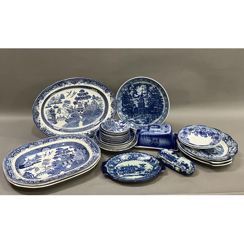 97 - A collection of blue and white ware including 19th century willow pattern plates, later wild rose pl... 