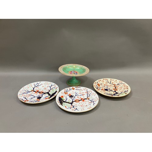 265 - Three Royal Crown Derby plates, underglaze blue, iron red and green enamel with birds perched in a t... 