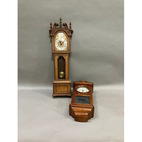 316 - Two reproduction wall clocks, one as a long case clock