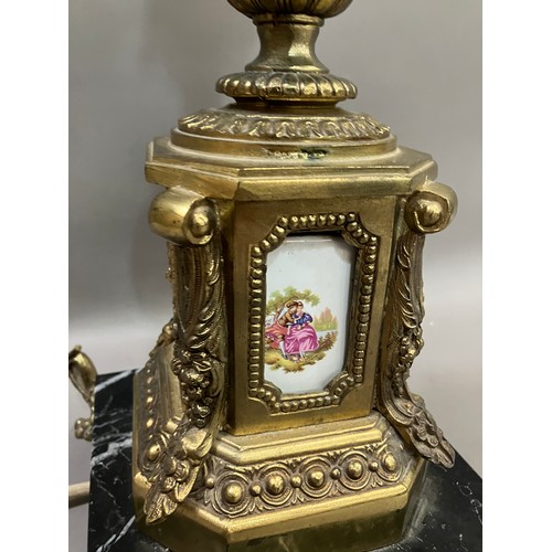 330 - A gilt metal moulded table lamp, the top rim moulded with grape vine, the base having painted cerami... 