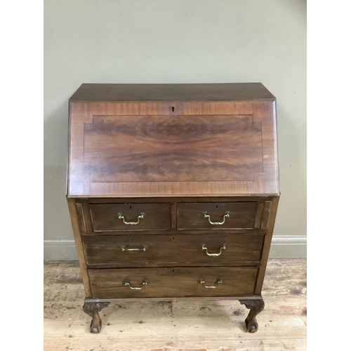 496 - A mahogany cross banded bureau, fall front over two long, two short drawers, 77cm wide