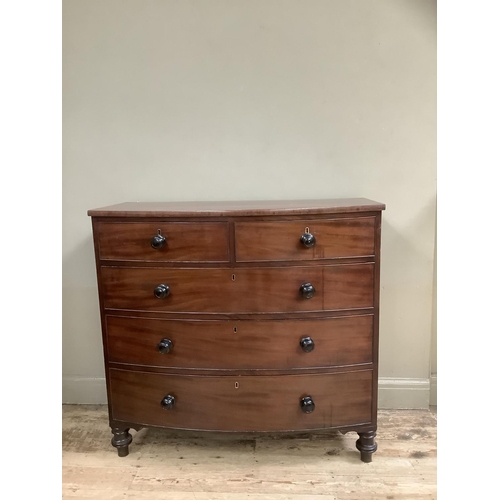 497 - A 19th century mahogany bow front chest of two short and three long graduated drawers on turned feet... 