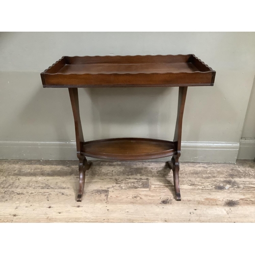 500 - A mahogany tray top occasional table on twin supports, 73cm wide