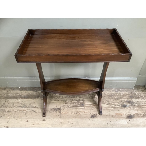 500 - A mahogany tray top occasional table on twin supports, 73cm wide