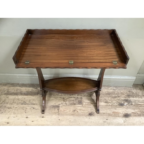 500 - A mahogany tray top occasional table on twin supports, 73cm wide