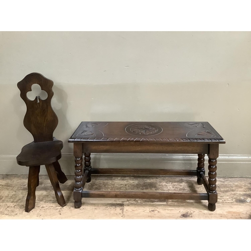 504 - An early 20th century oak stool, rectangular and carved to the top with leaves together with a later... 