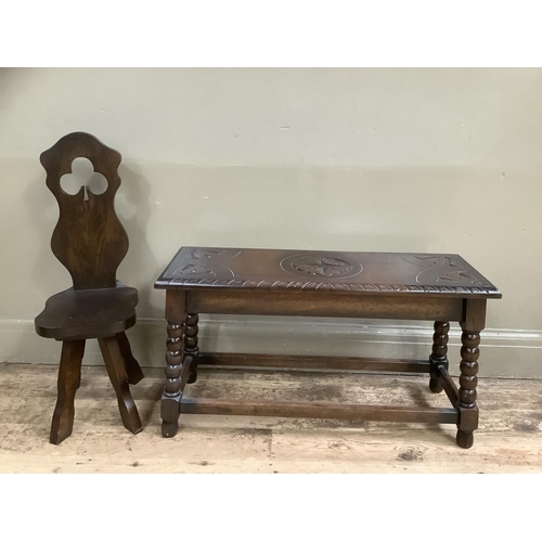 504 - An early 20th century oak stool, rectangular and carved to the top with leaves together with a later... 